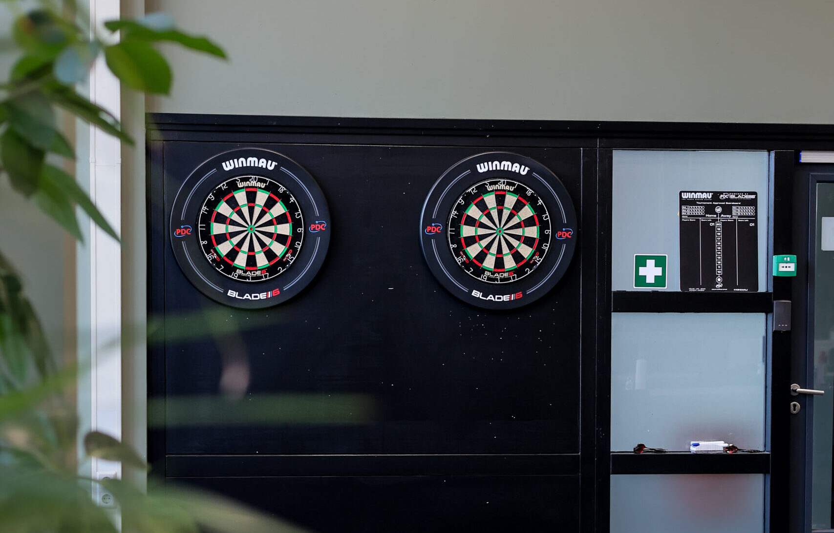 Picture of two dartboards on the wall