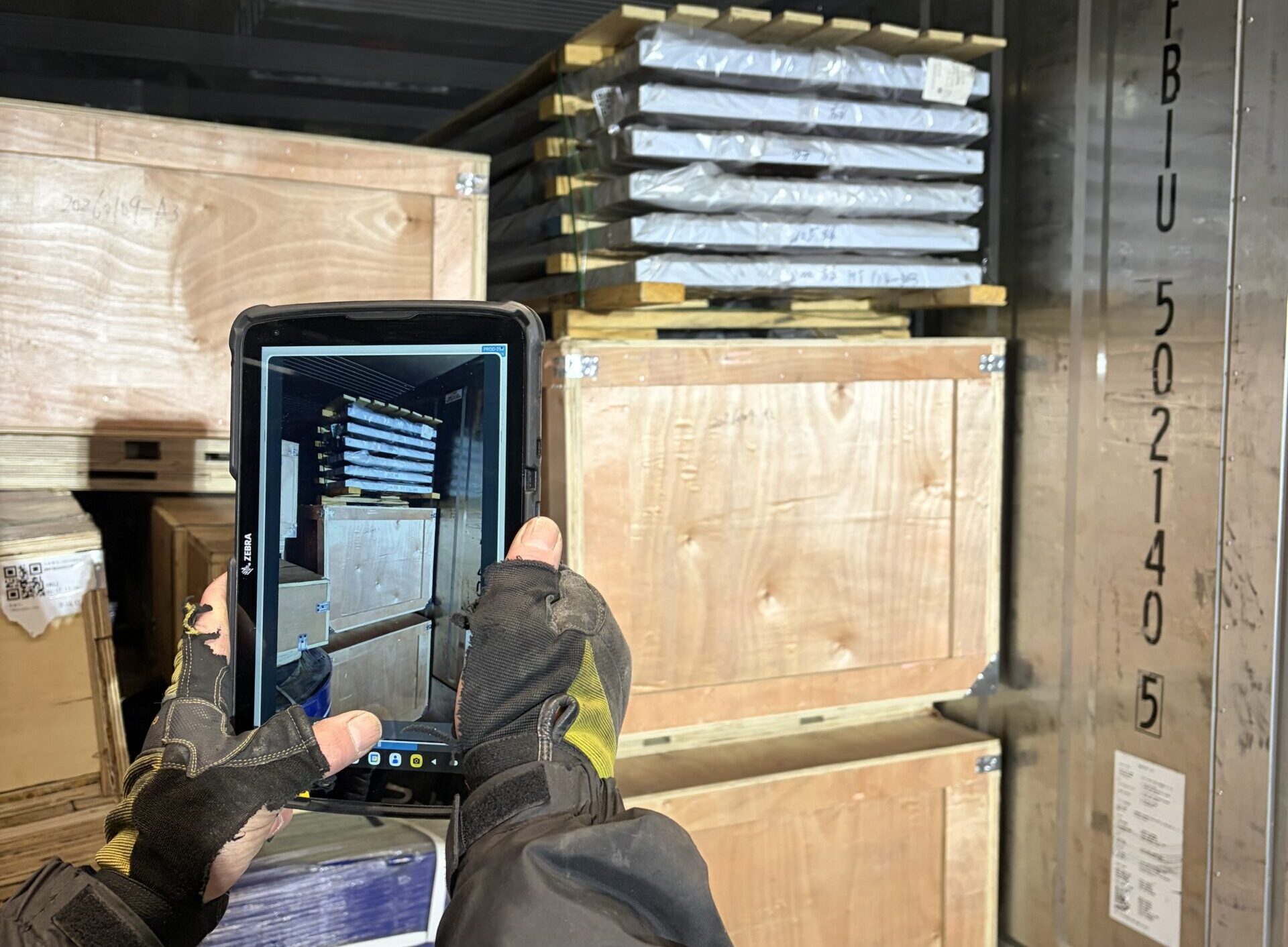 Person taking a picture of the inside of a container